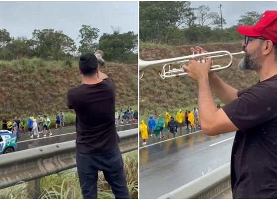 Homem toca berrante e trompete a pessoas em caminhada em BR - Metrópoles