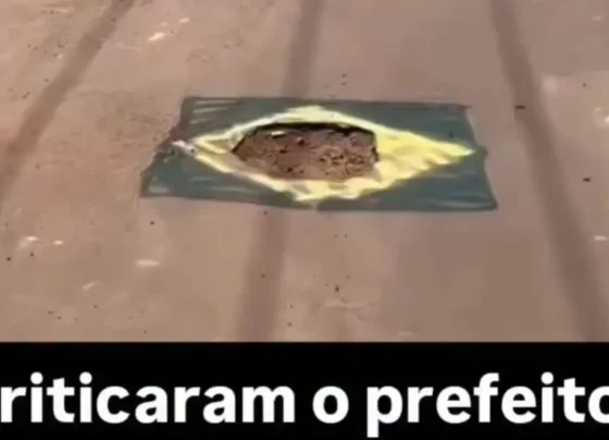 Em clima de Copa do Mundo, moradores pintam buracos nas ruas com cores do Brasil; vídeo “Só faltou escrever ordem e progresso”