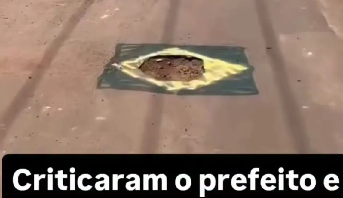 Em clima de Copa do Mundo, moradores pintam buracos nas ruas com cores do Brasil; vídeo “Só faltou escrever ordem e progresso”
